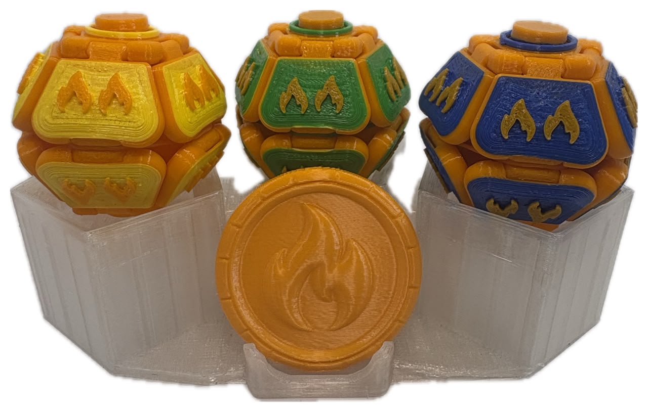 Pack da família Vulcânicos: três Mamolitks laranja com MamoCoin de chama