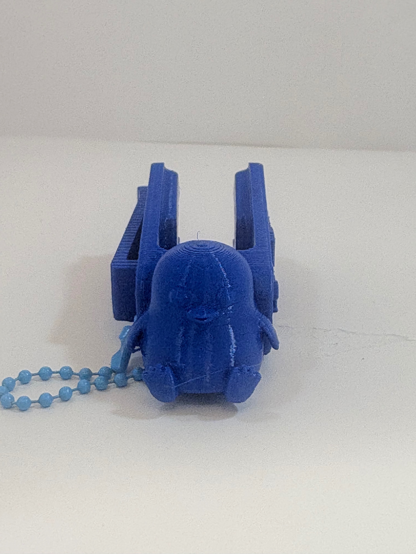 MamoSpin Pimzu — pinguim azul de frente